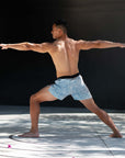 Flow shorts - Ocean Blue, designed for hot yoga, showcasing comfort and flexibility during yoga practice.