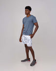 Man wearing Swerve Shorts in Nimbus Cloud, featuring 4-way stretch for maximum comfort and movement.