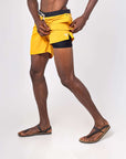 Flow shorts in saffron color, designed for hot yoga and active movement, showcasing moisture-wicking fabric.