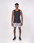 Man wearing Flow shorts in Snow Leopard design with a black tank top, showcasing fitness apparel for hot yoga.