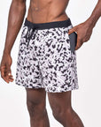 Flow shorts in snow leopard print, designed for hot yoga, showcasing moisture-wicking fabric and a comfortable fit.