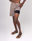 Model showcasing 4-way stretch Swerve Shorts in Smoky Quartz color, designed for movement and comfort.