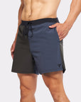 Flow shorts in blue and black, designed for hot yoga with moisture-wicking fabric and quick-dry lining.