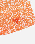 Flow shorts in Desert Orange with unique pattern and embroidered logo detail.