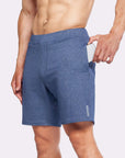 4-Way stretch swerve shorts in heather navy with hand in pocket for easy storage during workouts.