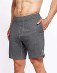 4-way stretch Swerve Shorts in Heather Grey worn by a man, showcasing comfort and flexibility for cross training.